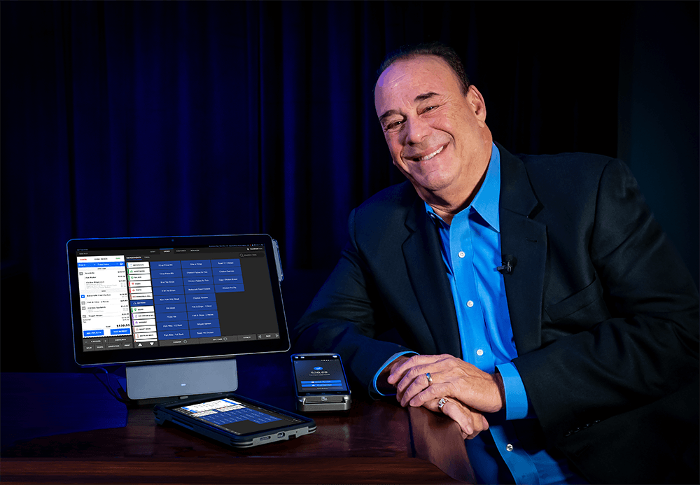 Jon Taffer, Bar Rescue host and Taffer’s Tavern founder, with a Shift4 Dine POS station