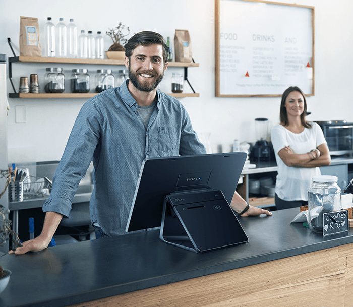 Restaurant owner at a Shift4 Dine POS station